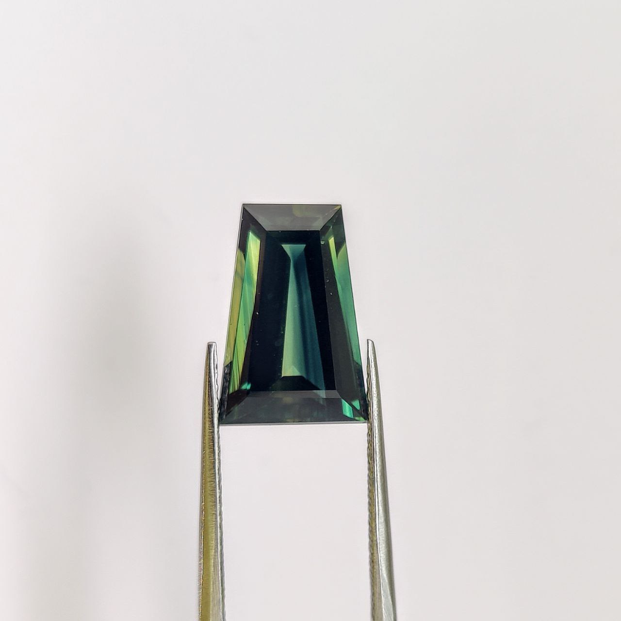 A tapered baguette 7.40 carat Australian sapphire that would have been extremely expensive coming from classical sources