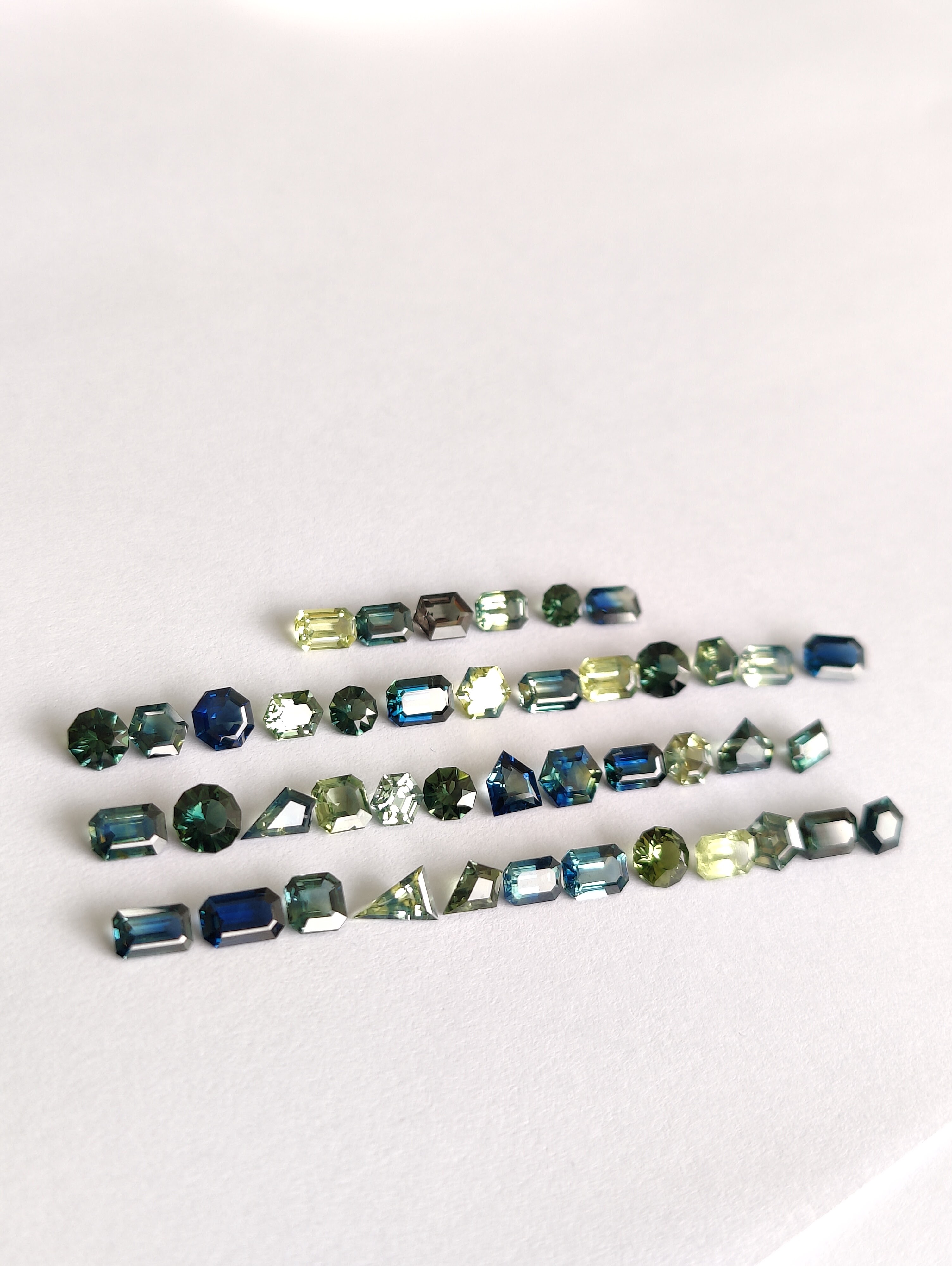 Fancy cut teal & parti sapphires lot