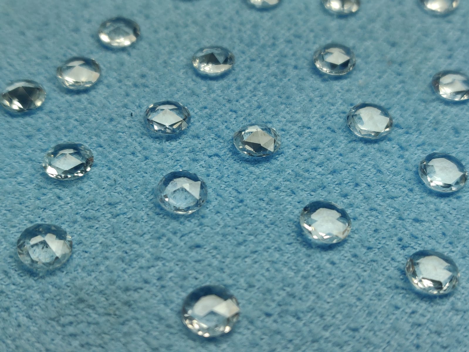 White rose cut round sapphires.